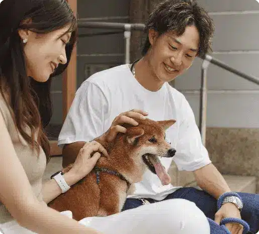 asian man woman with their shiba inu dog outdoors